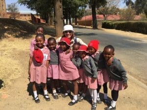 Maria Gonzales with school children, Lesotho