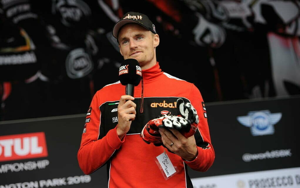 Chaz Davies auctions off his gloves, WorldSBK Auction at the Paddock Show, Silverstone