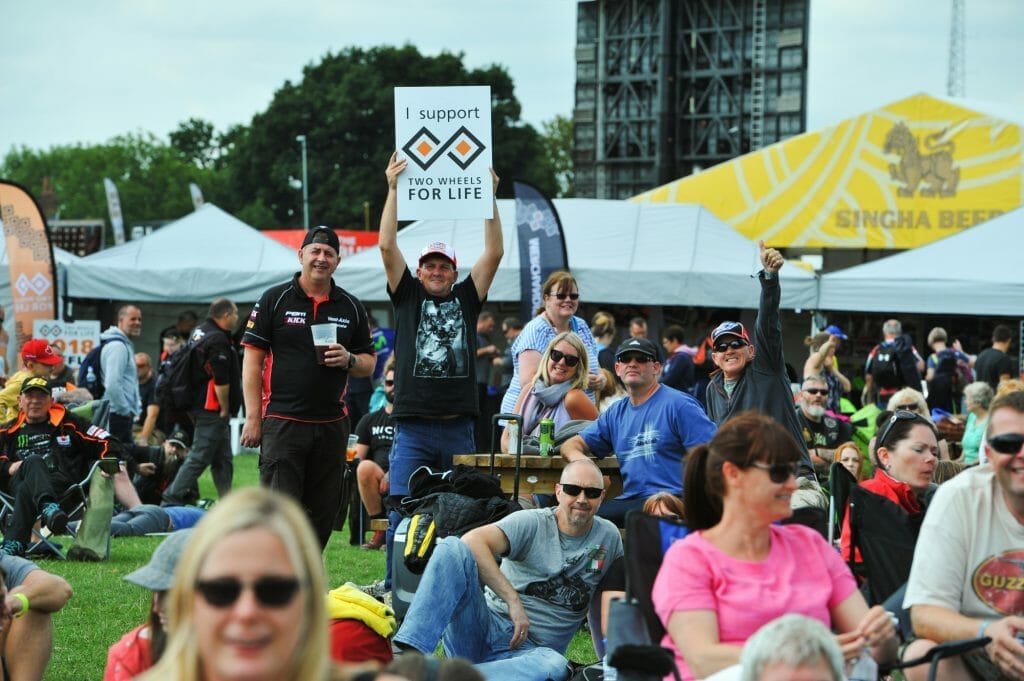 A Two Wheels for Life fan shows their support in the crowd