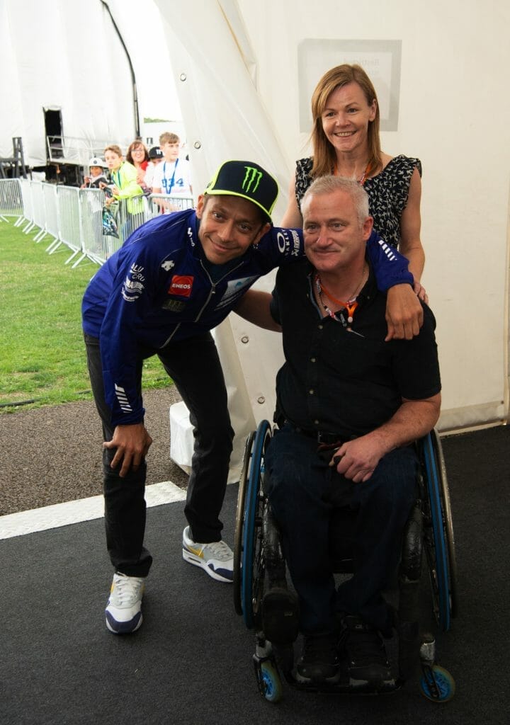 Valentino Rossi takes a photo with some of his fans