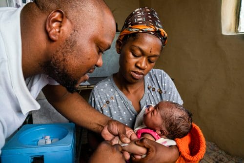 Lesotho, healthworker, mother, baby, newborn, motorcycle