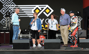 Andrea on stage with the team